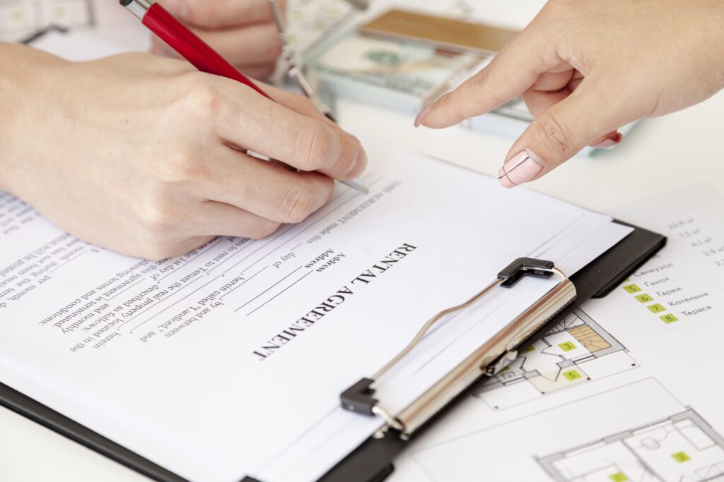 high angle man signing house contract 1